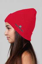 Girl wearing, Rogue Candy embroidered logo, on side red Beanie
