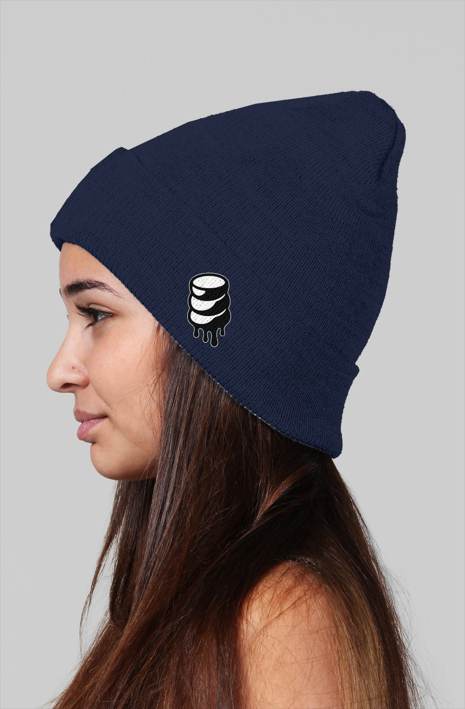Girl wearing, Rogue Small Stacked Hard Candy Drip on side navy blue Beanie
