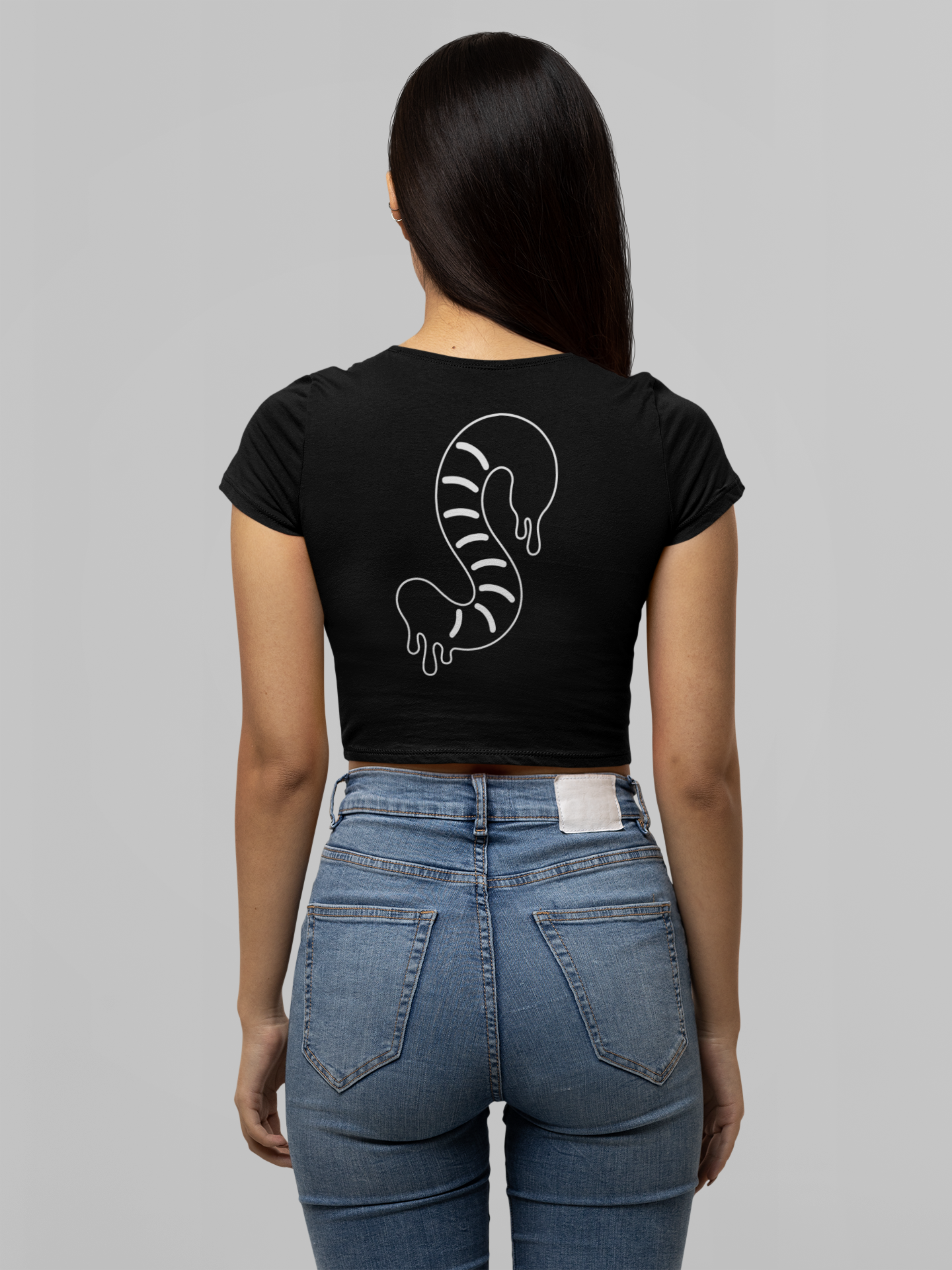 Girl wearing black baby crop tee gummy worm black and white design on back embroidered logo on front 