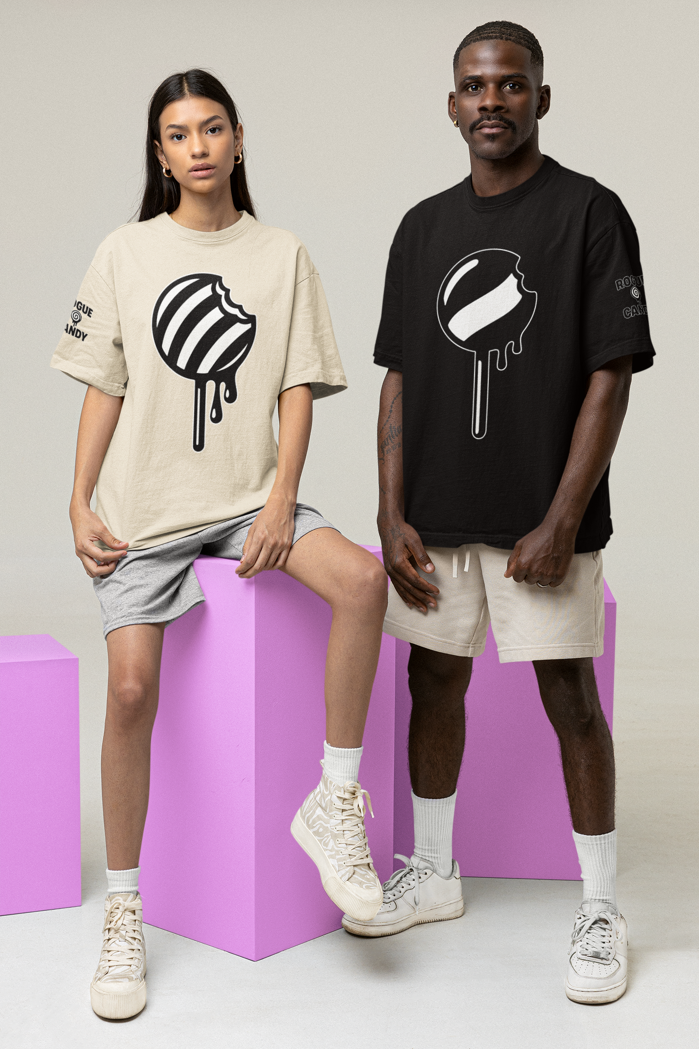 Two people wearing t-shirts with a unique design on a plain background