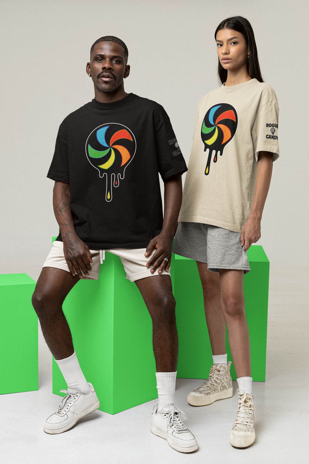 Two people wearing t-shirts with colorful designs on a gray background