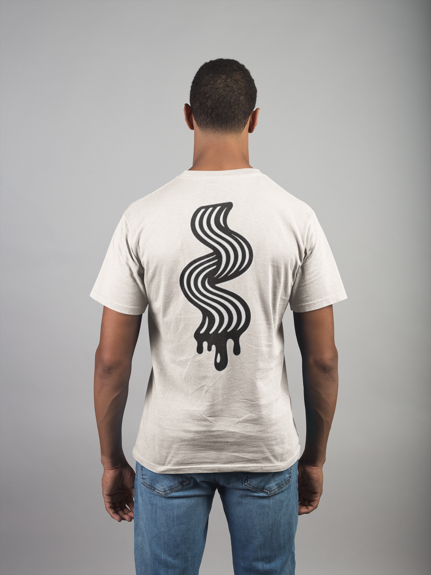 Man wearing a off white t-shirt with a black wavy line design on the back against a gray background